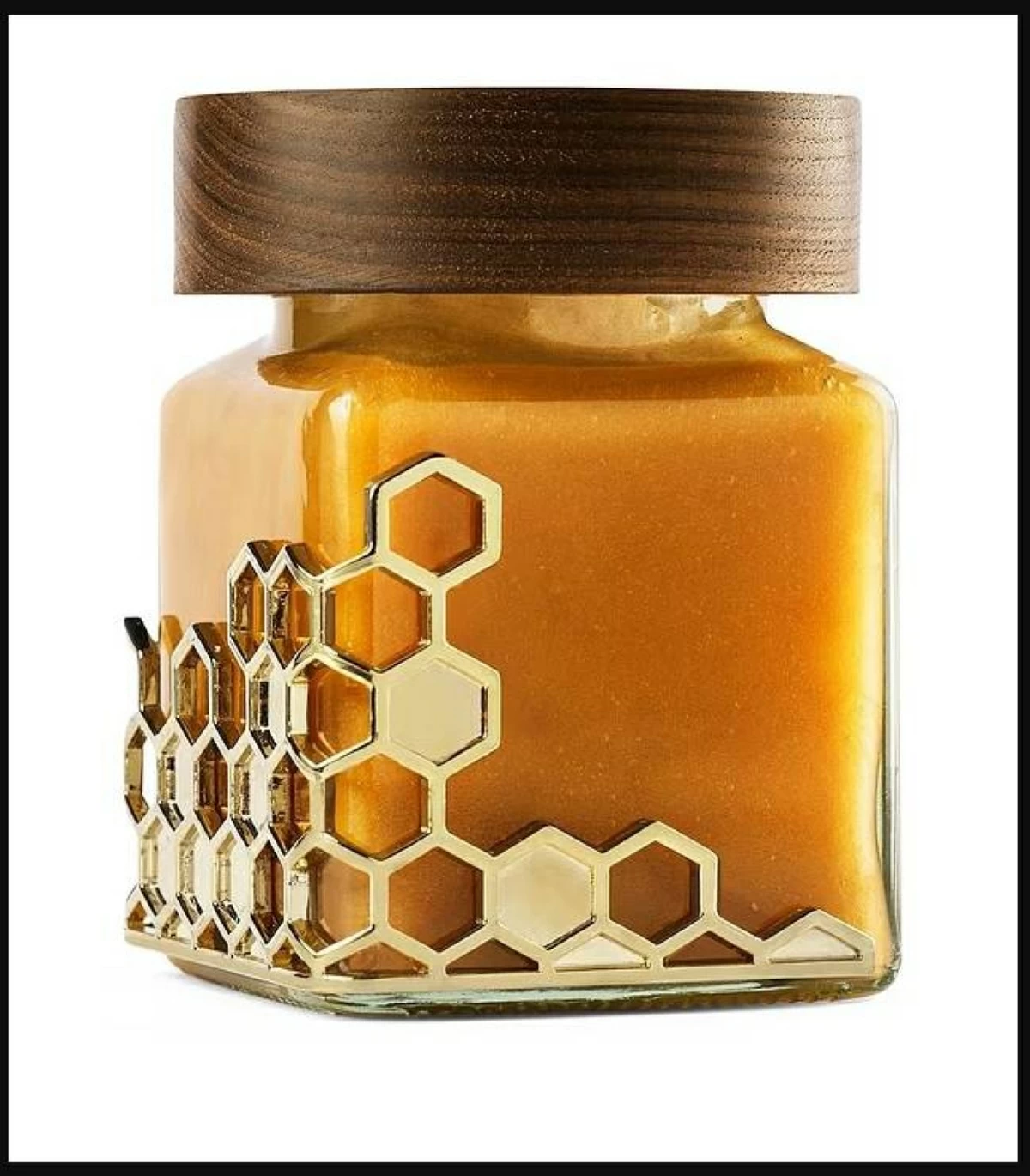 عبوة العسل مصنوعة يدوياً من خشب الجوز الأسود وبطانة جلد إيطالي وذهب عيار 18 قيراطاً