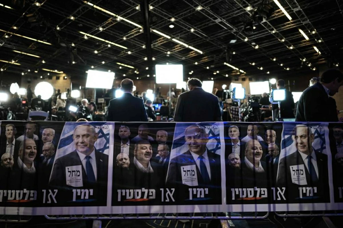 Journalists are waiting at the Likud party election night rally in Jerusalem on October 27, 2026, on the day of Israel's legislative election. Polls closed at 10 pm (2000 GMT) on October 27 in Israel's pivotal general election, which saw high voter turnout and veteran Prime Minister Benjamin Netanyahu fighting for his political life. (Photo by Jewel SAMAD / AFP)