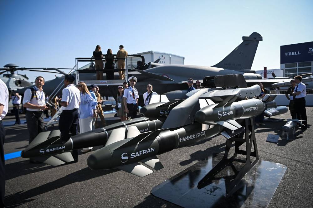 A display of Safran Hammer 250 XLR air-to-surface weapons beside a Dassault Rafale fighter jet at the Paris Air Show in Paris, France, on Monday, June 16, 2025. The 55th Paris Air Show runs 16-20 June at Le Bourget airport. Photographer: Matthieu Rondel/Bloomberg