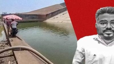 المسؤول والعمال خلال تفريغ السد