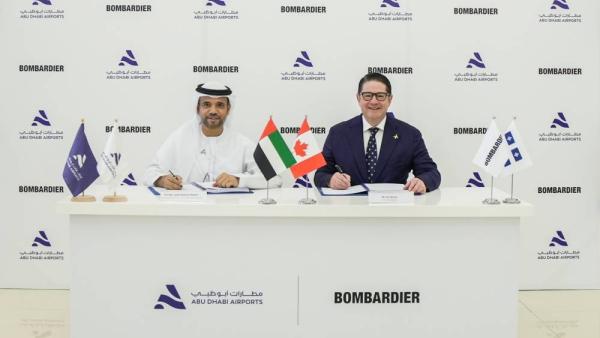 الظاهري ومارتل خلال توقيع الاتفاقية الظاهري ومارتل خلال توقيع الاتفاقية