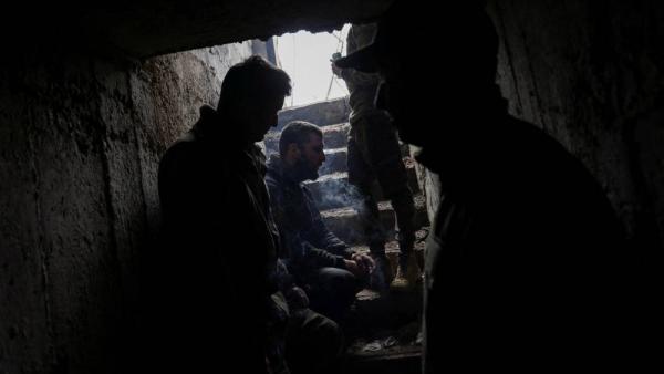 A Ukrainian tank unit crew takes cover and waits for shelling to cease in a bunker, amid Russia's invasion of Ukraine, near the bombed-out eastern Ukrainian city of Bakhmut, in the eastern Donetsk region, Ukraine, March 29, 2023. REUTERS/Violeta Santos Moura TPX IMAGES OF THE DAY