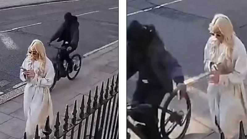 لص يسرق هاتف فتاة أثناء استخدامها له بالطريق