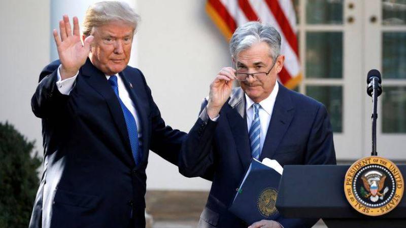الرئيس الأمريكي دونالد ترامب وجيروم باول 