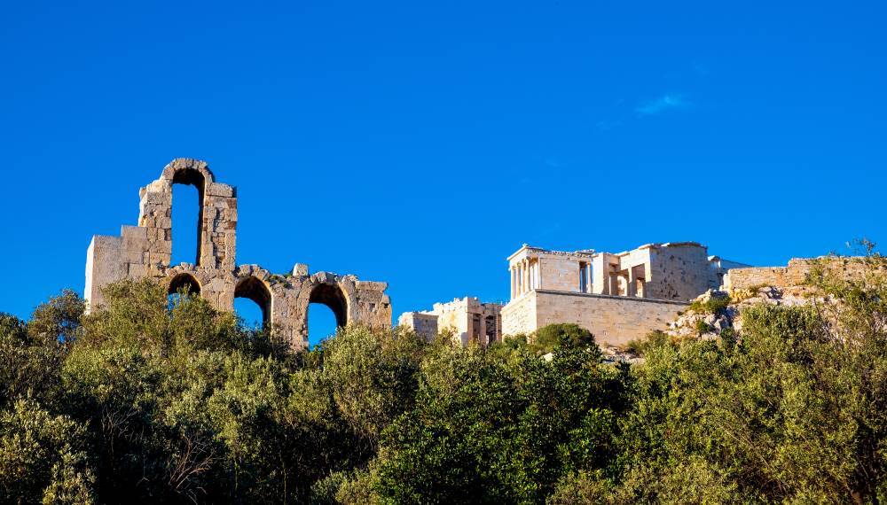 Athens, Attica / Greece - 2018/04/03: Panoramic view of Acropolis of Athens with Propylaea monumental gateway, Nike Athena temple and Odeon of Pericles amphitheater