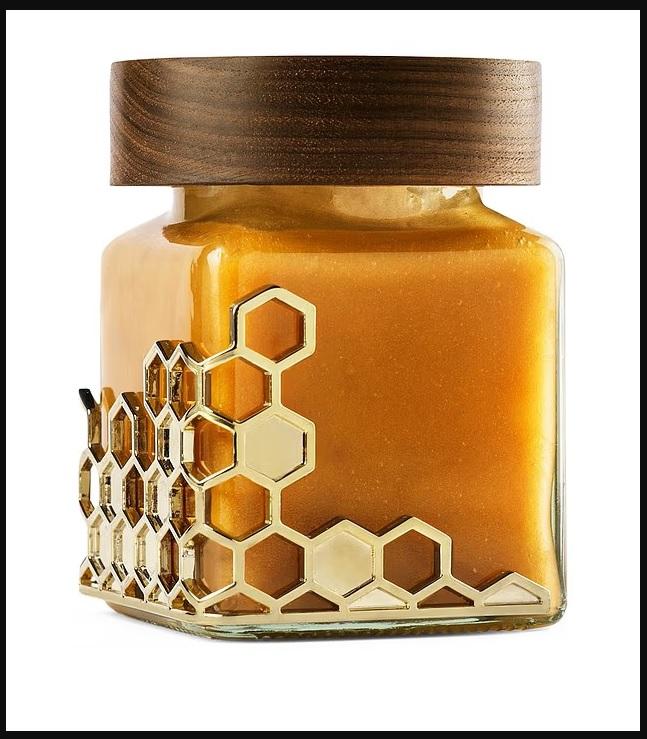 عبوة العسل مصنوعة يدوياً من خشب الجوز الأسود وبطانة جلد إيطالي وذهب عيار 18 قيراطاً