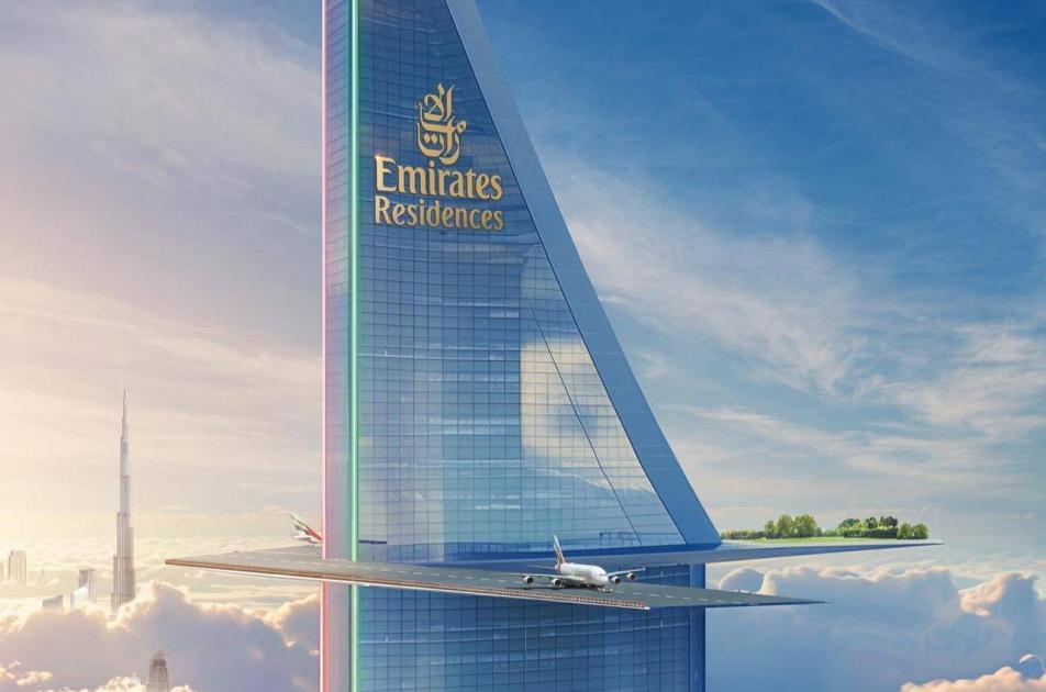 A tower in Dubai from Emirates Airlines.. topped with an aircraft runway