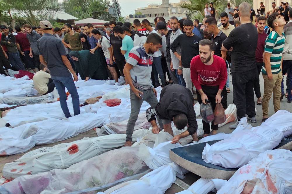 Bodies of Palestinians killed in Israeli strikes on houses in Jabalia refugee camp, lie at a hospital in the northern Gaza Strip, October 31, 2023. REUTERS/Anas al-Shareef