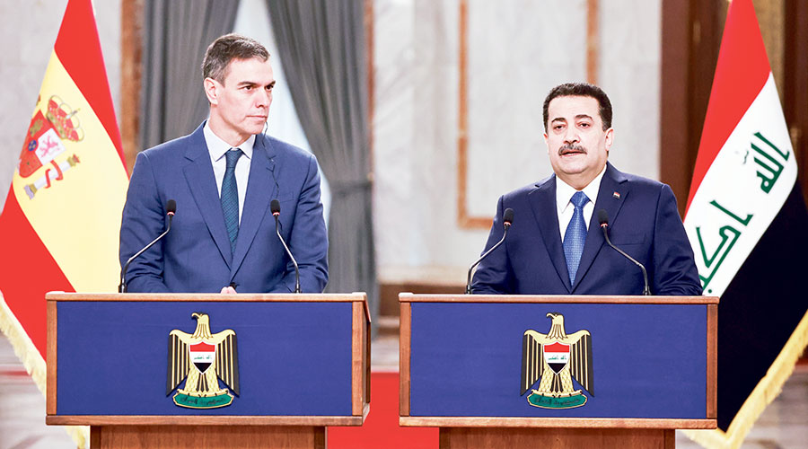 السوداني وسانشيز خلال مؤتمر صحفي في بغداد (أ ب) 