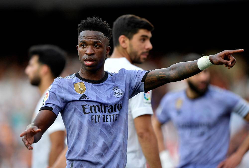 FILE PHOTO: Soccer Football - LaLiga - Valencia v Real Madrid - Mestalla, Valencia, Spain - May 21, 2023 Real Madrid's Vinicius Junior gestures towards a fan REUTERS/Pablo Morano/File Photo