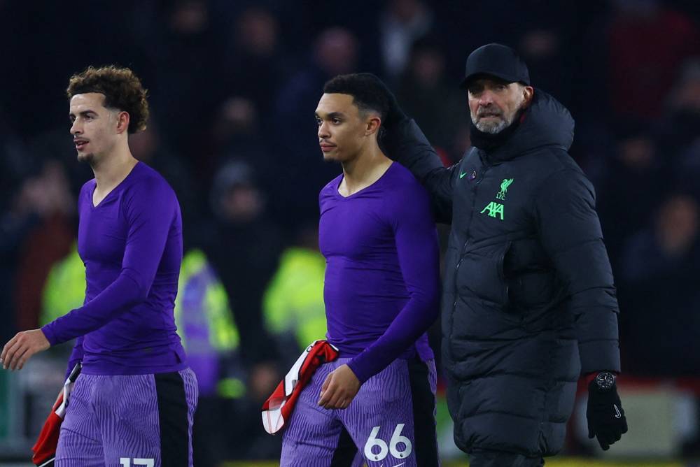 ترنت ألكسندر أرنولد مع مدربه كلوب