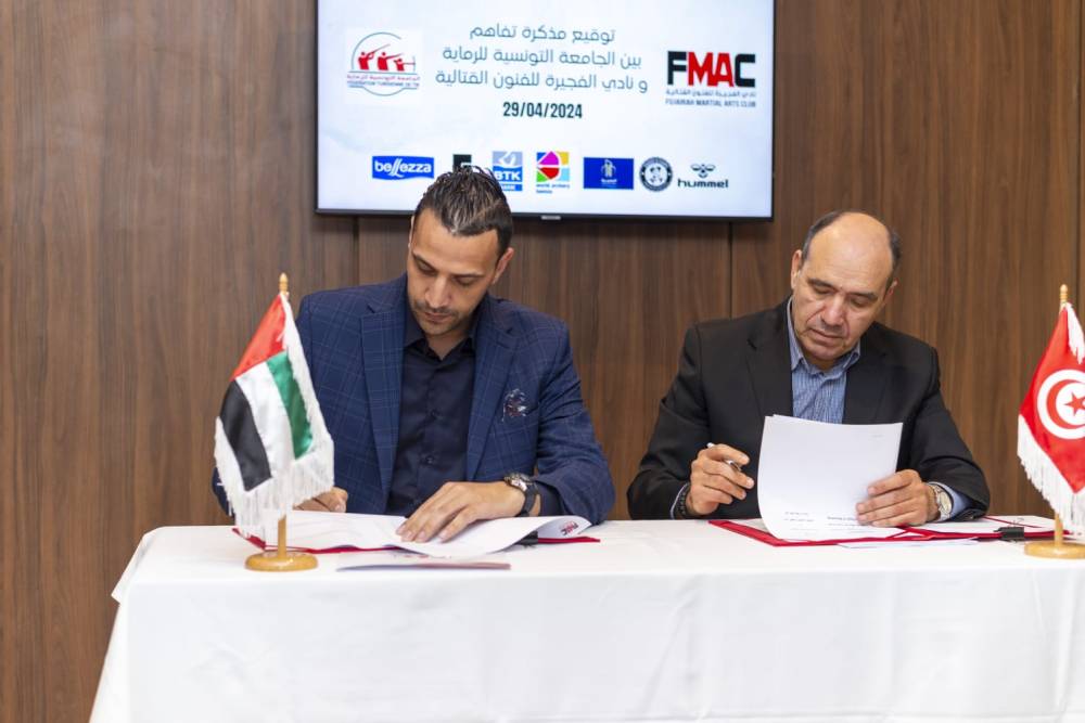  أبو شاويش خلال توقيع الاتفاقية 