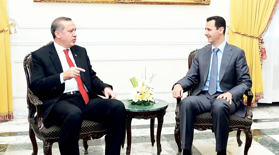  أردوغان والأسد خلال لقاء سابق في حلب يوم 6 فبراير 2011 (رويترز) 