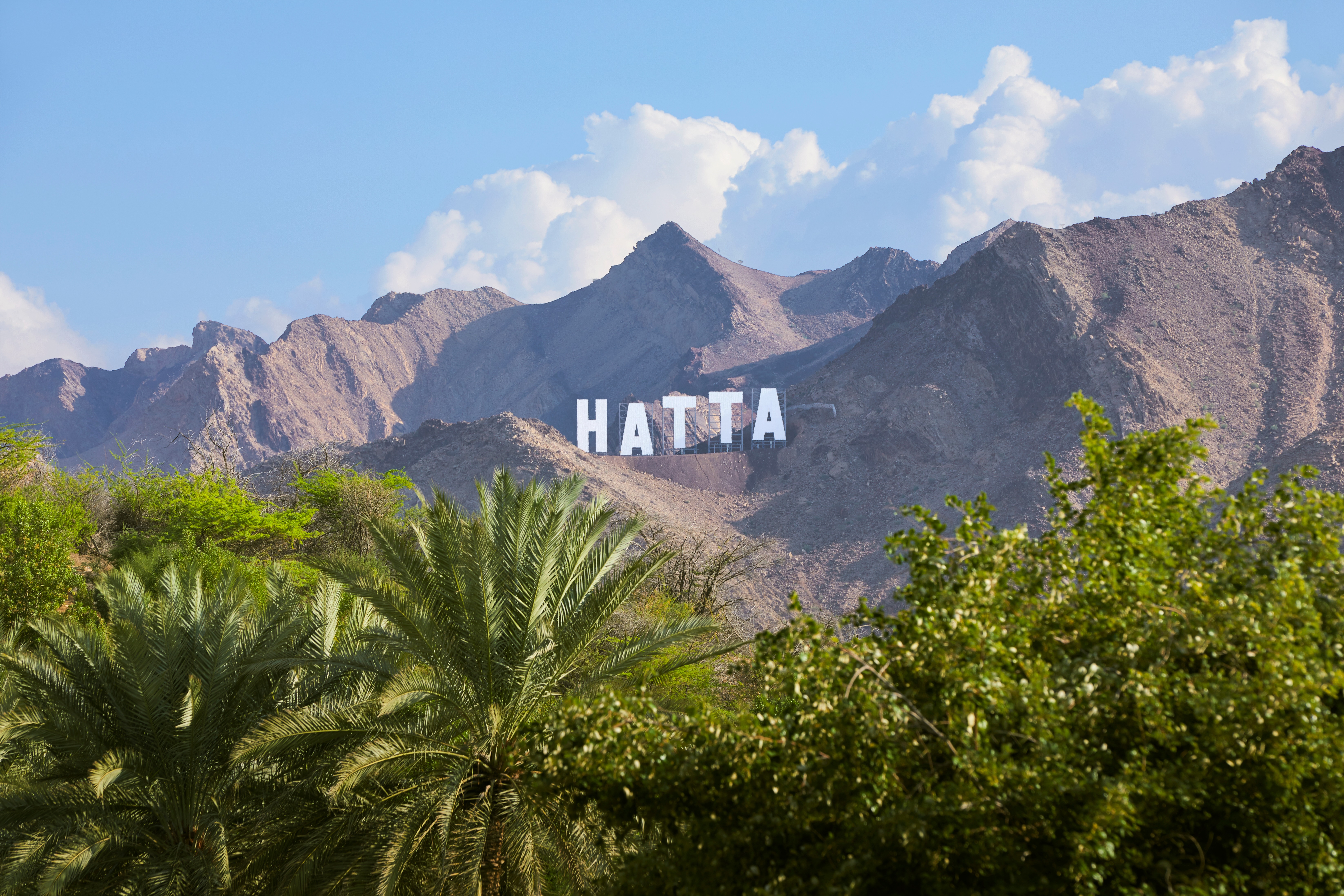 The sign with the name of the town of Hatta in the Emirate Dubai, United Arab Emirates