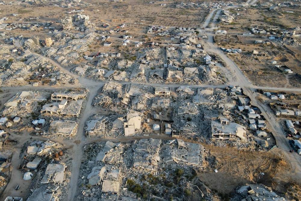 This aerial picture shows destroyed buildings in Gaza City's Al-Remal neighbourhood on October 23, 2025. A fragile ceasefire has brought respite to Gazans exhausted by two years of fighting, but even without the daily bombing they are struggling to live amid the catastrophic destruction wrought by the war. (Photo by AFP)