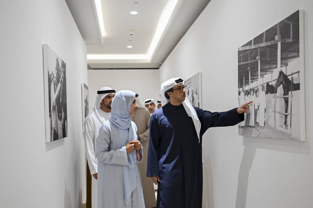 ABU DHABI, UNITED ARAB EMIRATES - December 07, 2025: HH Sheikh Mansour bin Zayed Al Nahyan, UAE Vice President and Deputy Prime Minister (R), views a photograph during the launch of Al Khail Square project, at Abu Dhabi Equestrian Club.

( Eissa Al Hammadi / UAE Presidential Court )
---