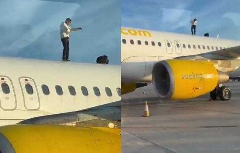 وسط صدمة الركاب.. شاب يعتلي سطح طائرة في إسبانيا