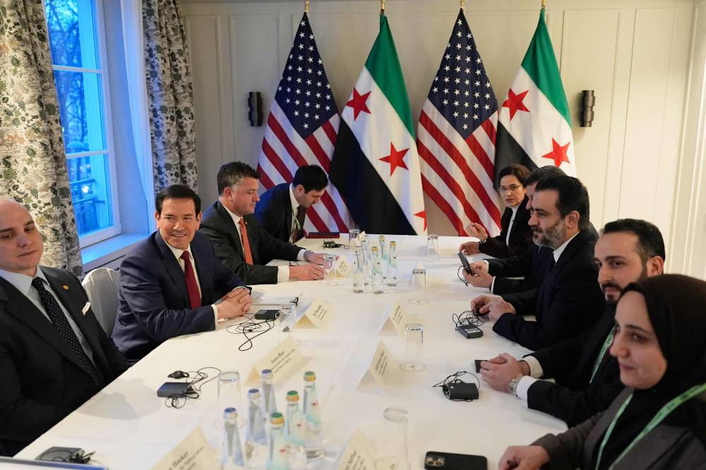 جانب من اجتماع وزير الخارجية الأمريكي ونظيره السوري على هامش مؤتمر ميونخ للأمن(أ ف ب ) 