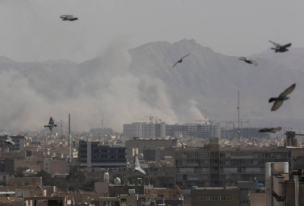 Smoke rises following an explosion, after Israel and the U.S. launched strikes on Iran, in Tehran, Iran, February 28, 2026. Majid Asgaripour/WANA (West Asia News Agency) via REUTERS ATTENTION EDITORS - THIS PICTURE WAS PROVIDED BY A THIRD PARTY
     TPX IMAGES OF THE DAY