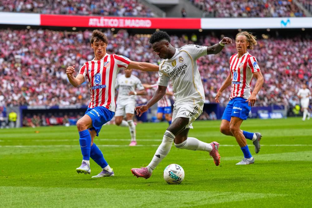 فينيسيوس نجم الريال خلال لقاء سابق مع أتلتيكو